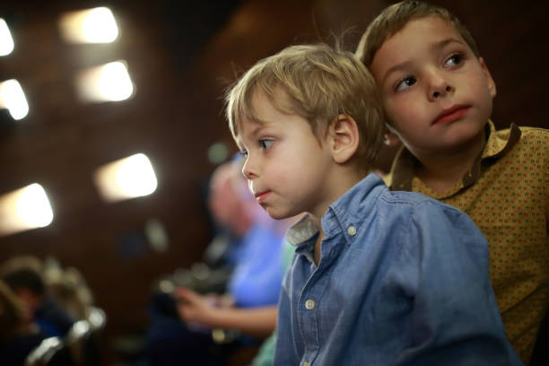 istock Two brothers in theater 927446896