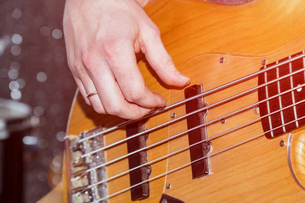 istock Hands of the guitarist's bass 927447532