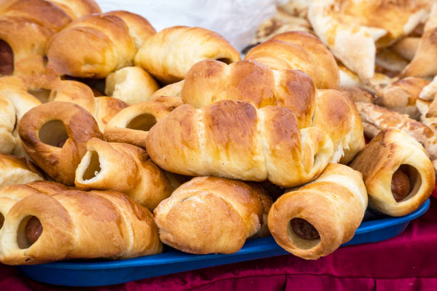 istock Sausages in a dough on a tray 927447556