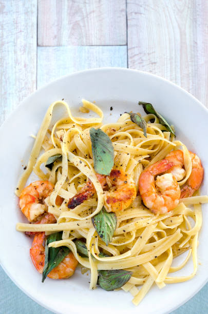 istock Pasta with prawns and basil leaves. 927448914