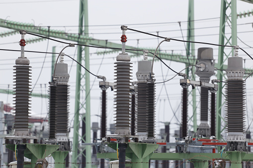 Electrical switchyard used for voltage distribution close up photography.