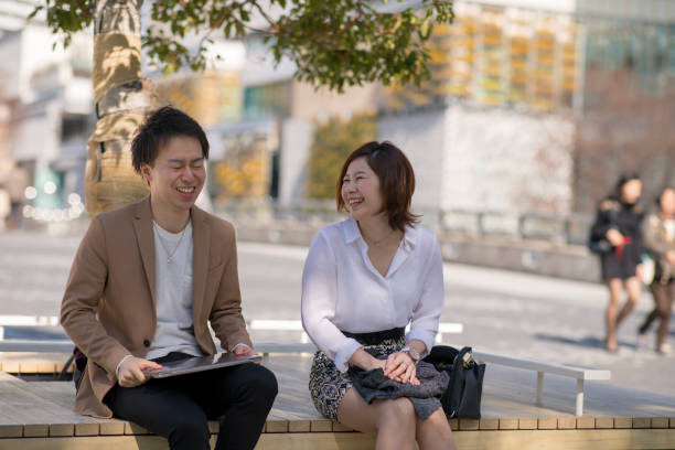 istock Business colleagues taking a break outside under the sun 927455420