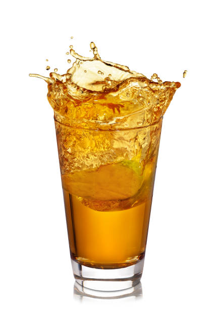 istock glass of splashing apple juice 927455478