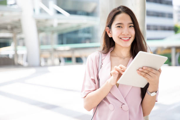 istock Young Asian working woman getting ready before meet up with client 927455548