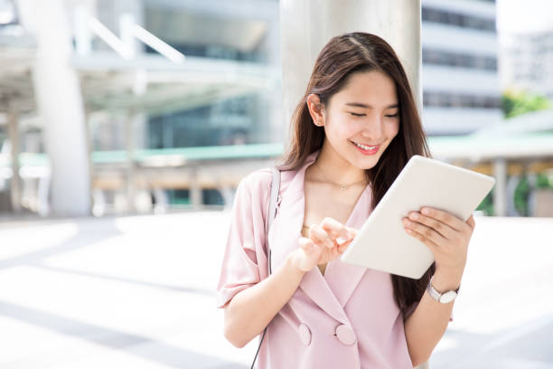 istock Young Asian working woman getting ready before meet up with client 927456122