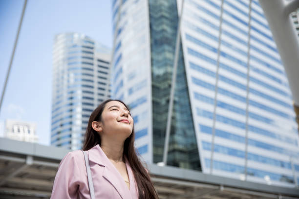 istock Young Asian working woman going out to see client 927456324