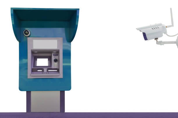 ATM for money withdrawal and surveillance camera isolated on white