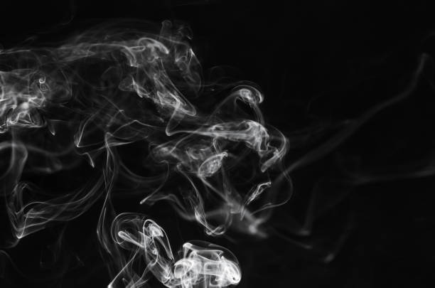 istock abstract movement of white smoke in dark background. 927469112