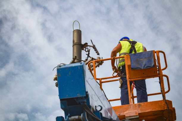 istock Power line worker fixing from the truck basket. 927481656