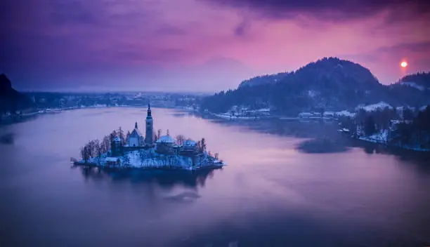 Aerial view of Bled lake in sunrise light, beautiful island with old church. Slovenia