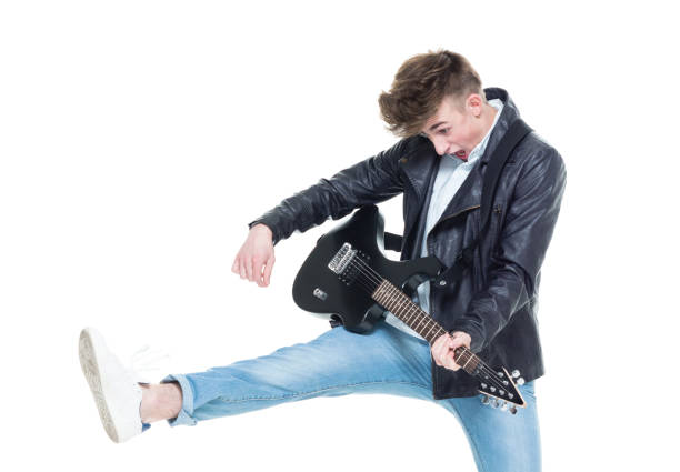istock Handsome young male rocking out with a guitar 927488826