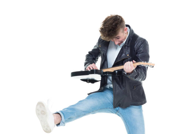 istock Handsome young male rocking out with a guitar 927489060