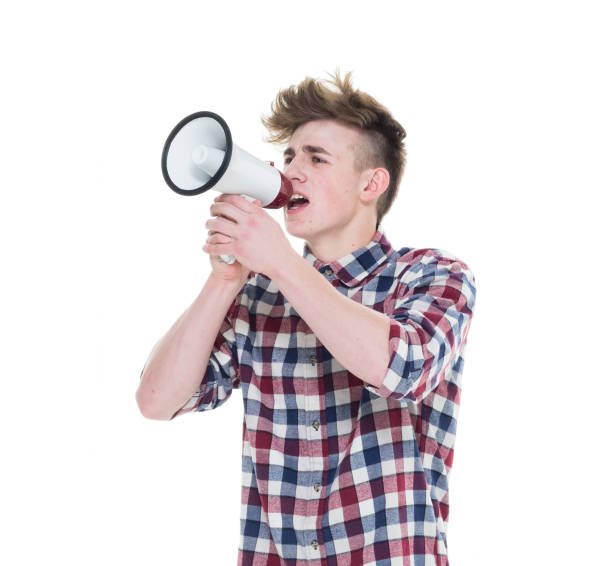 istock Young male holding a megaphone 927491364