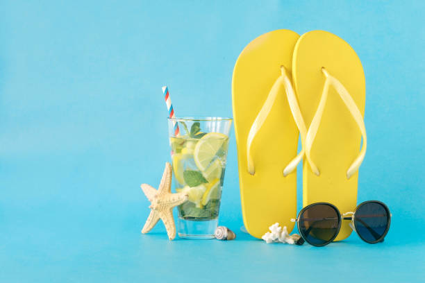 istock Colorful summer background. Beach accessories on blue background 927491684