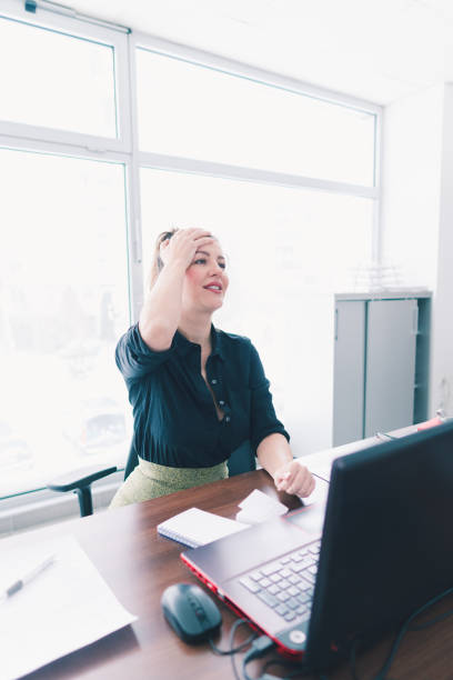 istock Businesswoman have a long day at work 927495750