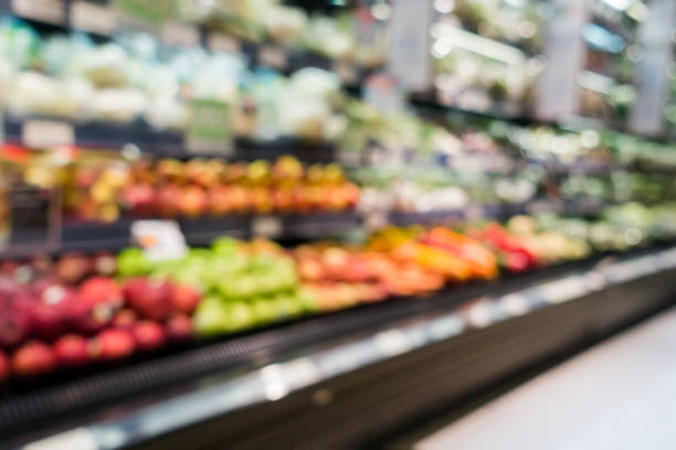 Blurry background in supermarket in fruit section