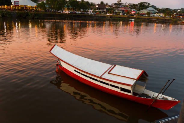 traditional wooden boat on the Sarawak River traditional wooden boat on the Sarawak River, Kuching, Malaysia kuching waterfront stock pictures, royalty-free photos & images
