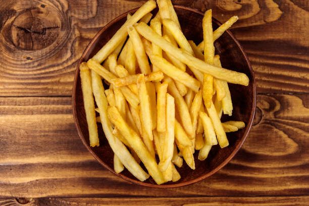 istock French fries on wooden table 927496224