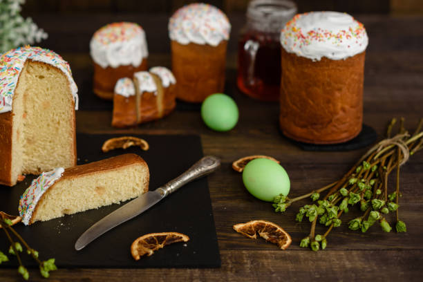istock Easter cake and colorful eggs on a wooden table 927496898