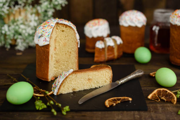 istock Easter cake and colorful eggs on a wooden table 927496904