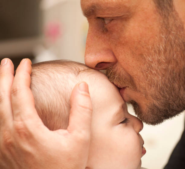 Father kissing his baby