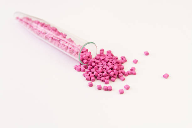 istock Plastic pallets . Plastic raw materials in granules for industry. Polymeric dye pink on a white background. Plastic granules after processing of waste polyethylene and polypropylene.Polymer. 927503650