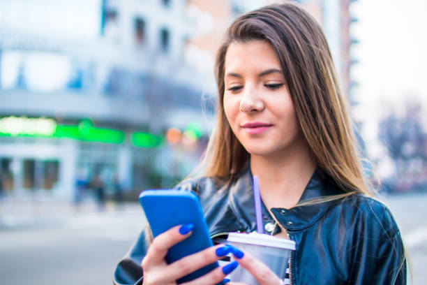 istock Young woman looking at mobile phone. 927504182