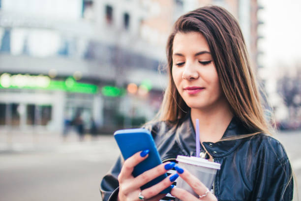 istock Young woman looking at mobile phone. 927504256