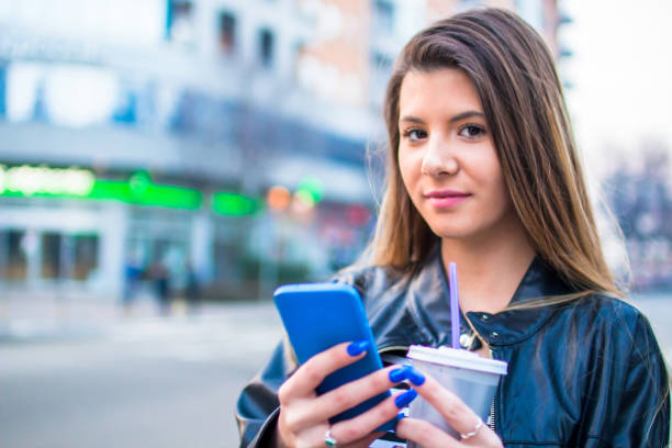 istock Young woman looking at mobile phone. 927504324