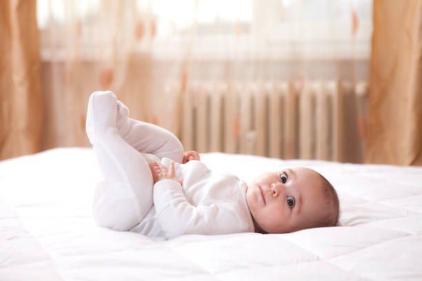 istock Beautiful baby in white clothes 927504440