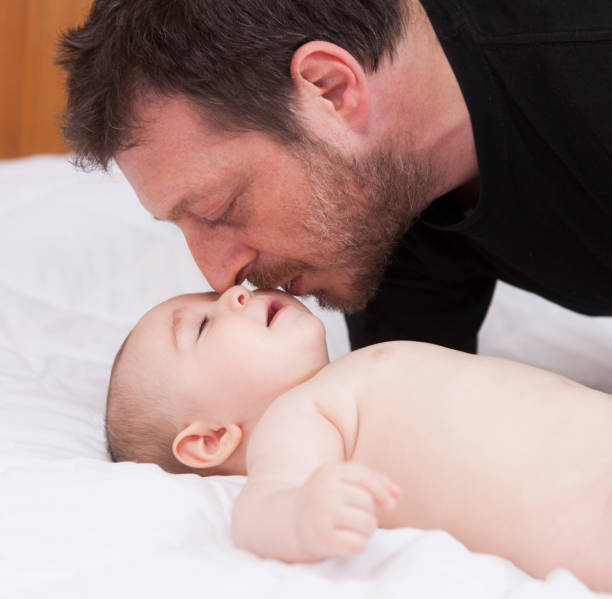 istock Father kissing his baby 927504474