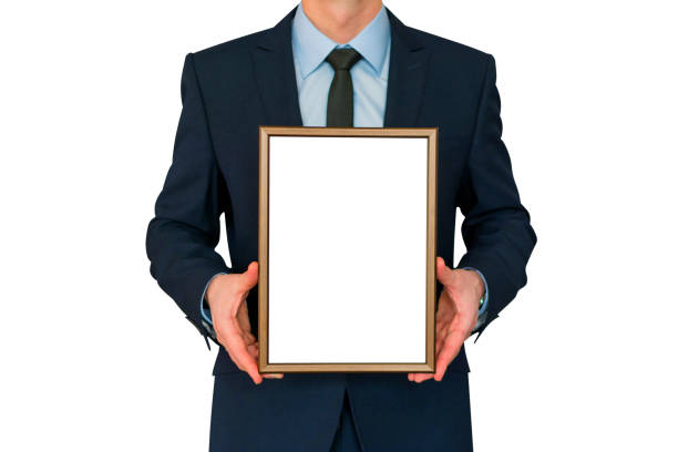 istock Mockup. Business man holding in hands empty blank photo frame. 927507554