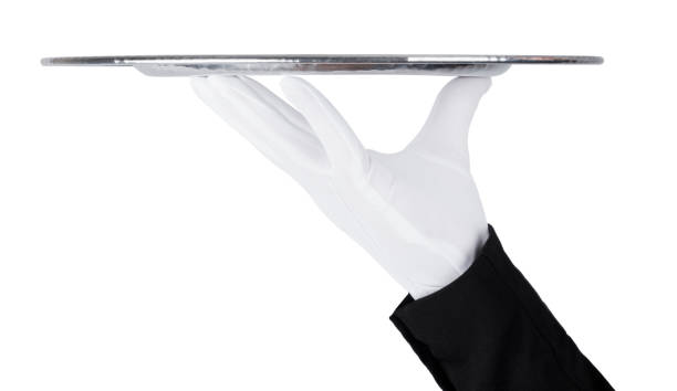 istock Servant white glove holds stainless steel tray 927513266