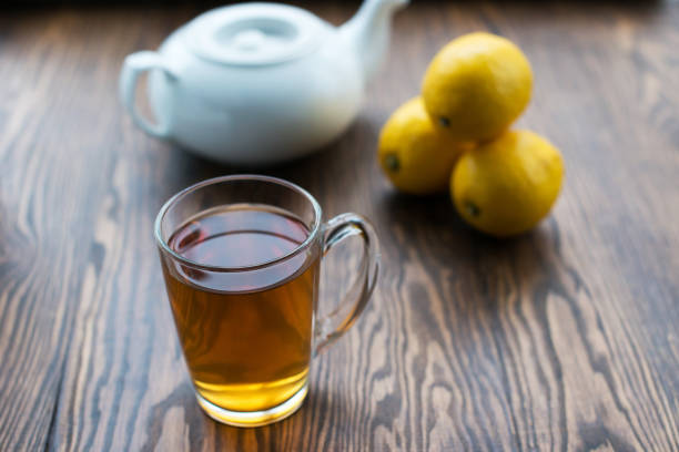 istock Teapot and cup of tea with lemon 927513276