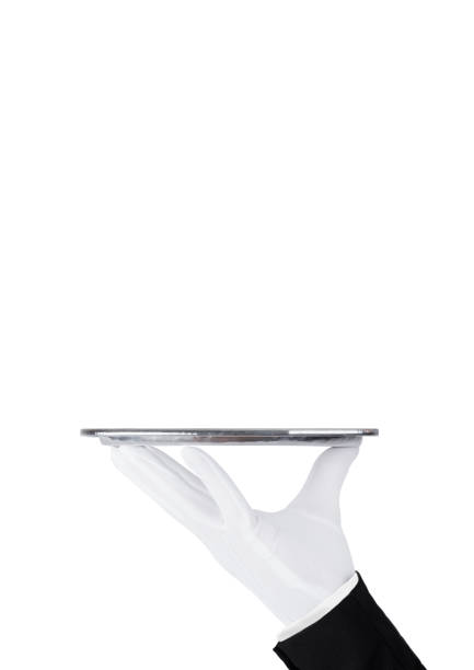 istock Servant white glove holds stainless steel tray 927516776
