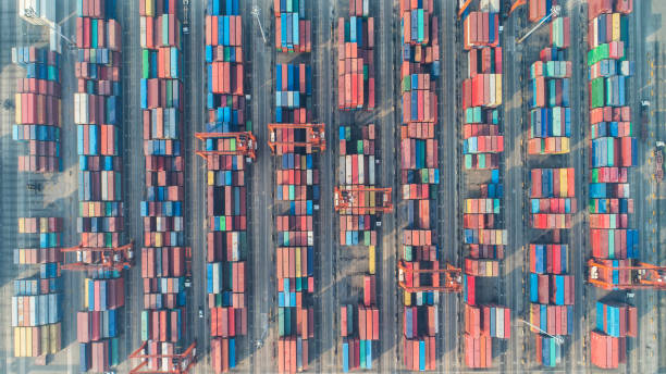 istock Container ship in export and import business and logistics. Shipping cargo to harbor by crane. Water transport International. Aerial view 927516824