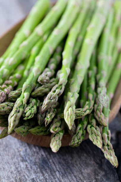istock asparagus on wooden surface 927518354