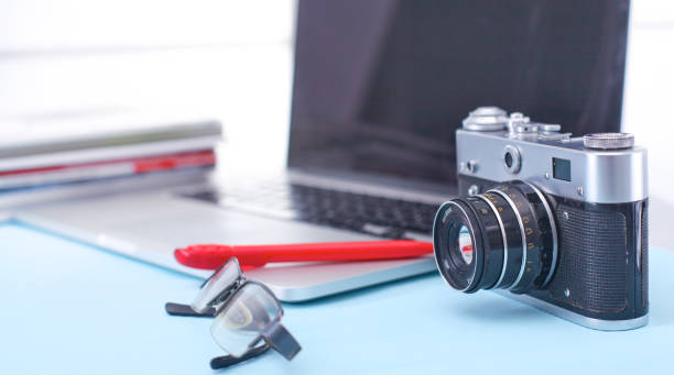 istock Designer table with him lying on the instruments and camera 927522402