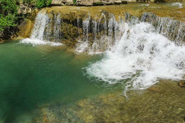 istock Big deep bowl washed waterfall clean mountain river Janet 927525342