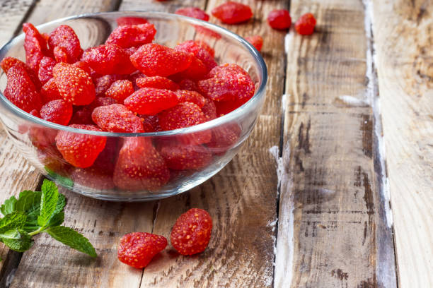 istock Dried Strawberries on a vintage background 927530328