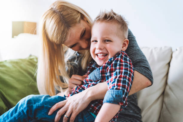 istock Cute little boy smiling with his mommy 927539684