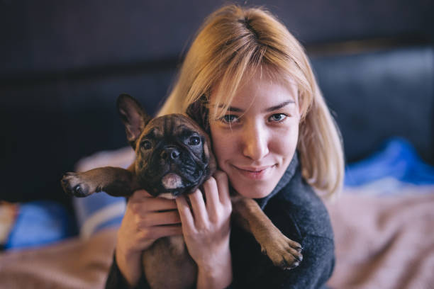 istock Cute girl embracing her dog 927539758
