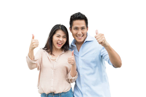 istock couple love excited smiling with thumb up gesture 927545652