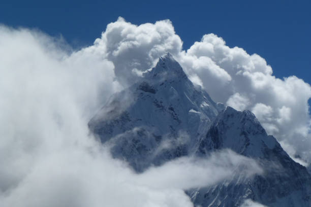 istock Mount Ama Dablam with big clouds and blue sky, seen from Thokla pass, Everest Base Camp trek, Nepal 927548010