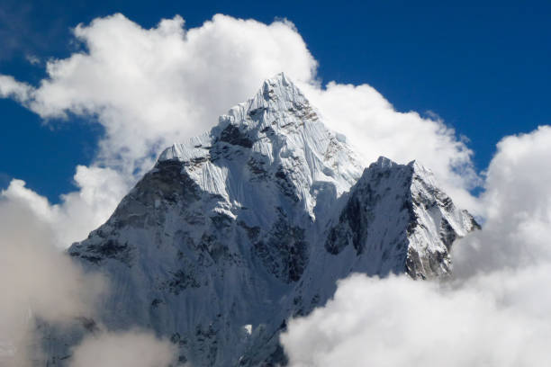 istock Mount Ama Dablam with big clouds and blue sky, seen from Thok La pass, Everest Base Camp trek, Nepal 927548220