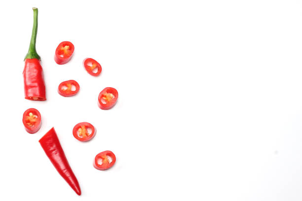 istock sliced red hot chili peppers isolated on white background top view 927549578