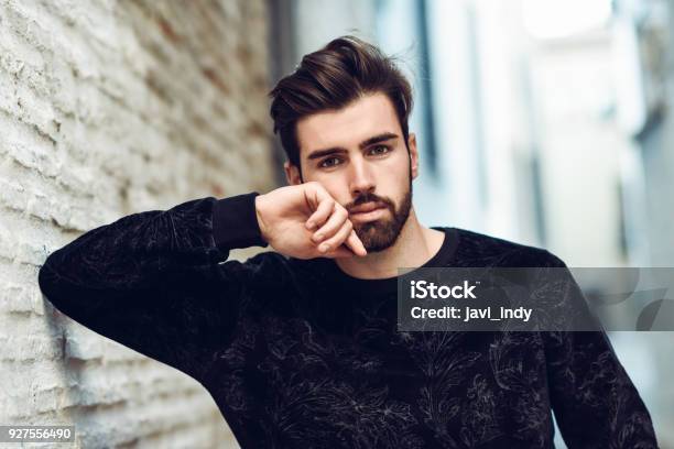 Young Bearded Man Model Of Fashion In Urban Background Wearing Casual Clothes Stock Photo - Download Image Now