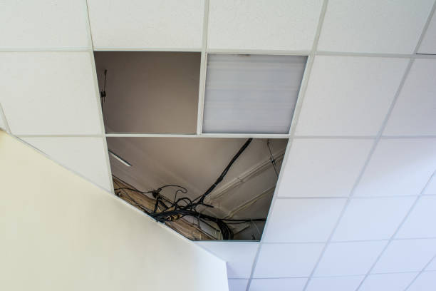 construction of a modern false ceiling in the building of an old building stock photo