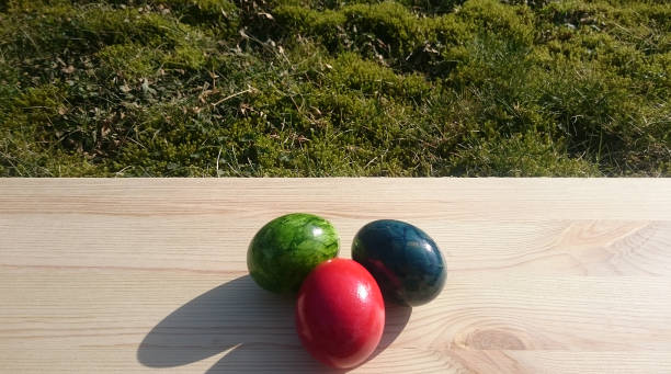 istock colorful eggs on a wooden board 927573334