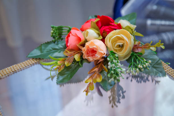istock Artificial red, yellow rose bouquet . Artificial flowers decorative background 927579044